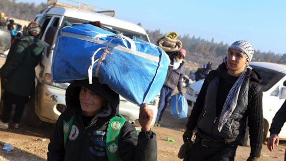 A young boy is evacuated from Aleppo on Monday.