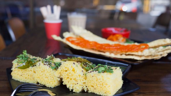 Haman dhokla, a steamed cake sprinkled with mustard seeds and curry leaves, at Chatkazz.