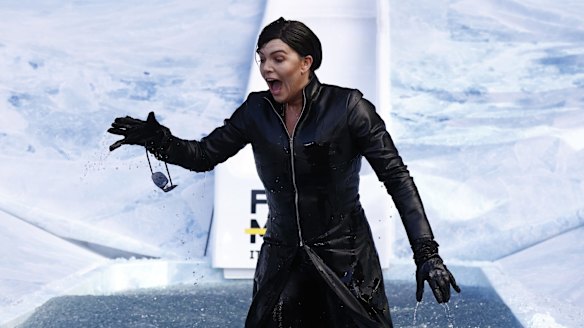 Rebecca Madden, TV personality, goes down the slide for Big FightMND Freeze 8, as Trinity from The Matrix.