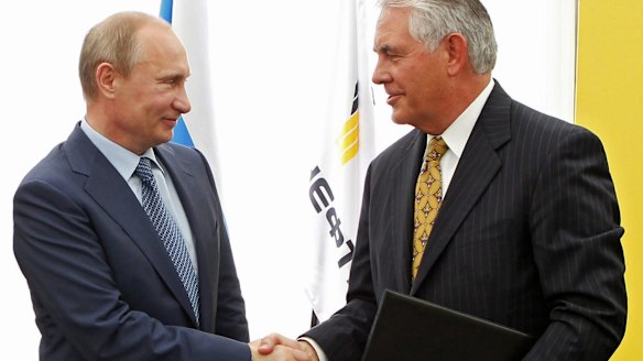 Mr Putin, left, and ExxonMobil chief executive Rex Tillerson.