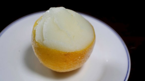 Sharp sweet lemon sorbetto served in a half lemon.