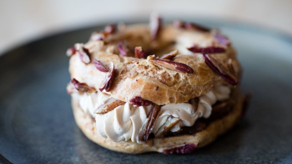 The paris-brest has a piped paste of blitzed scraps from his vanilla and cocoa nib cakes and is served with caramel chantilly and brown sugar salted pecans.