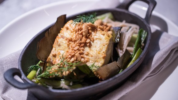 Cha ca la vong, turmeric-marinated kingfish with herbs and bun noodles.
