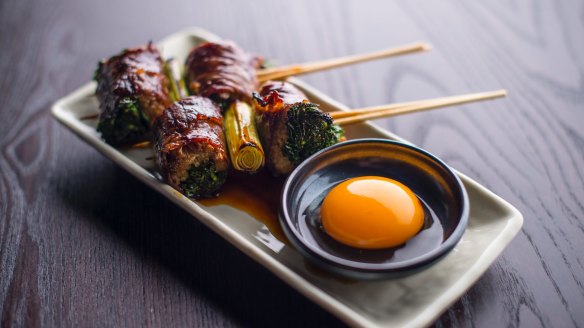 Sukiyaki skewer (wagyu beef) with raw egg yolk. 