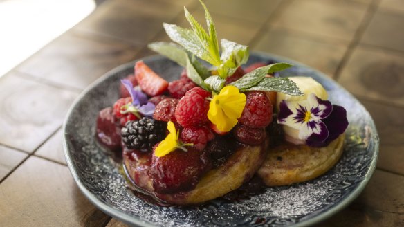 Warm toasted crumpets with berry compote.