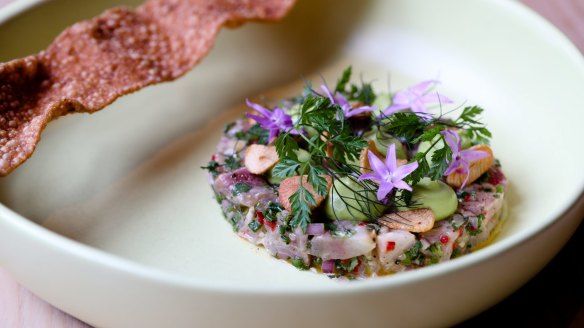 Kingfish ceviche, avocado, finger lime and a coriander cracker.