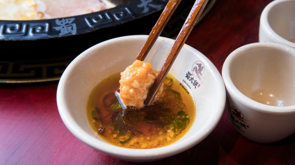 Prawn balls once cooked in the broth.