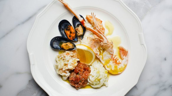 Seafood antipasto of raw and cooked scampi, crab, squid, prawns and mussels.
