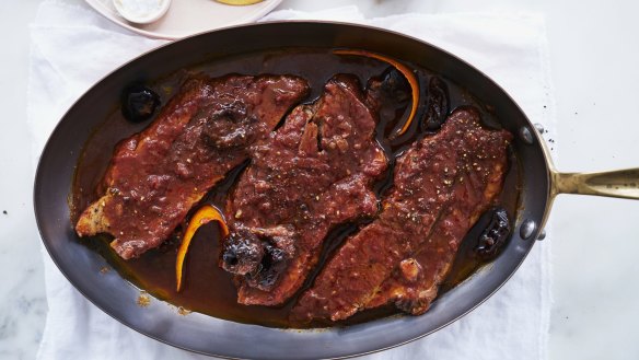 Braised brisket with prunes and bacon.
