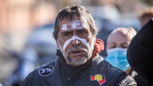 A mourner outside the Aboriginal Health Service, Nicholson St in Fitzroy.
