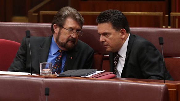 Senators Derryn Hinch and Nick Xenophon as midnight approaches in the Senate at Parliament House in Canberra on Tuesday.