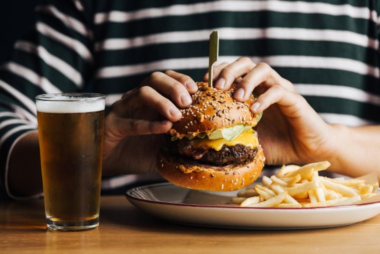 Pub classics such as burgers and fish and chips are on the menu at the Beach Hotel, Albert Park.