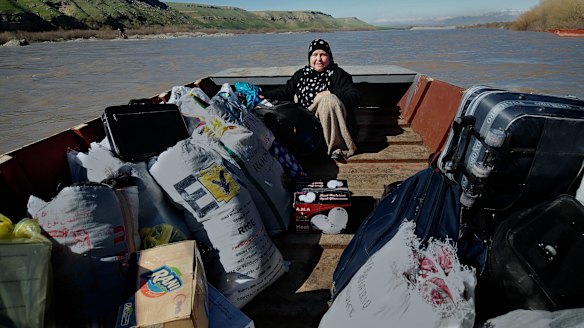 A refugee crosses the Tigris River from Iraqi Kurdistan into north-eastern Syria which is predominantly under Kurdish control.   