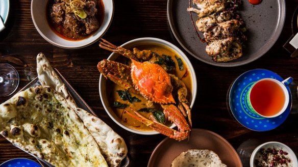 Clockwise from top left: Laal maas (meat curry), pepperberry chicken, nandu kuzhambu (crab curry), appam, garlic naan.