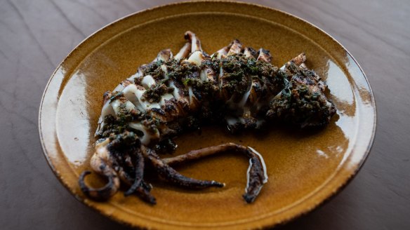 Grilled whole southern calamari with salmoriglio dressing.