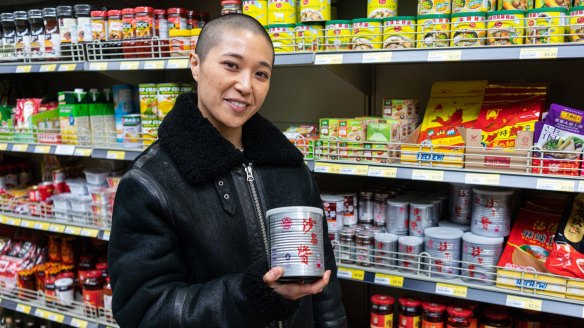 "When I was a kid, I literally put a spoonful of this in everything," says Ho, holding a tin of Bull Head barbecue sauce.