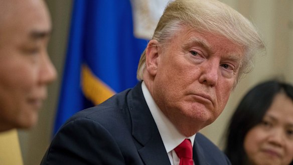Donald Trump listens as Vietnamese Prime Minister Nguyen Xuan Phuc speaks during their meeting in the White House in May.