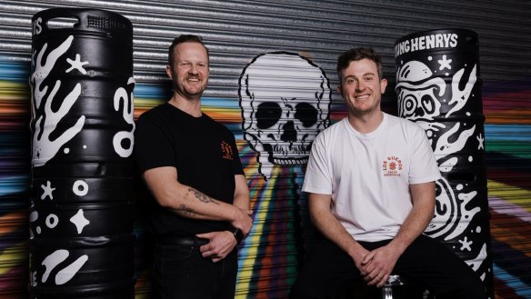 Chefs Dave McKinn (left) and Alex White of Los Gueros sling tacos at Young Henry's brewery in Newtown.