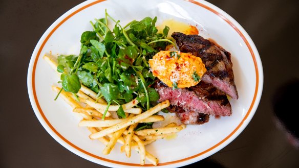 Grilled-and-sliced black angus rib eye topped with tomato butter with a good handful of watercress.