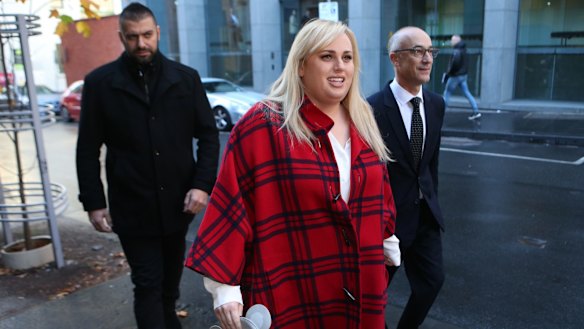 Rebel wears tartan: Rebel Wilson appears outside court.