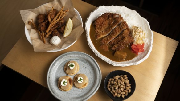 From left: Mixed mushroom karaage, cream cheese takuan, salt and vinegar soybeans and Japanese pork katsu curry rice at White Moon. 