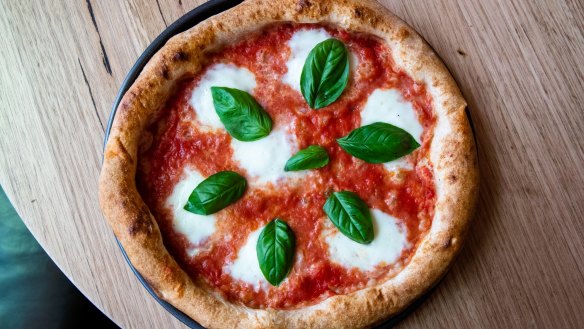 Tomato, buffalo mozzarella and basil pizza. 