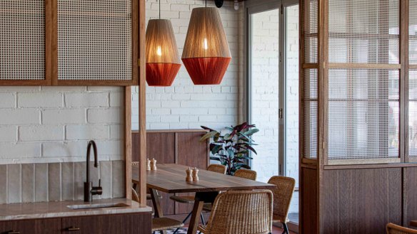 The cafe is broken into various nooks by timber joinery, making a large space feel smaller and warmer.