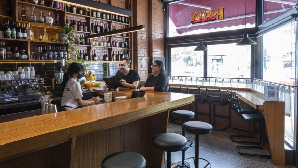 Timber, antique light fittings and white cafe curtains add nonna chic to Rocco's Bologna Discoteca in Fitzroy.