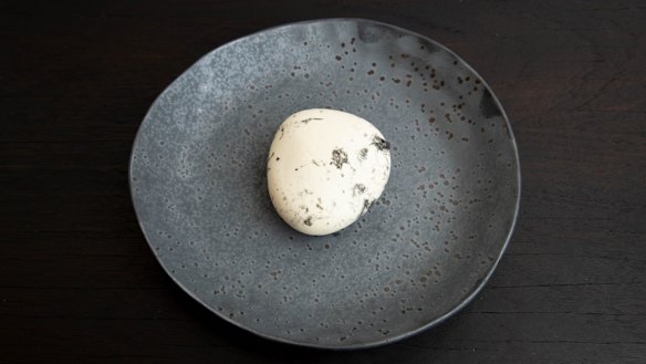 Yuzu and black sesame pebble.