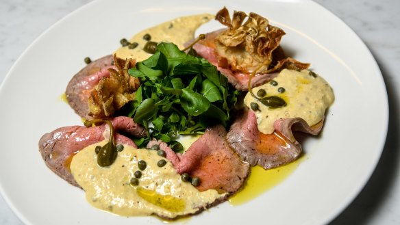 Vitello tonnato with crisp artichokes and caperberries.