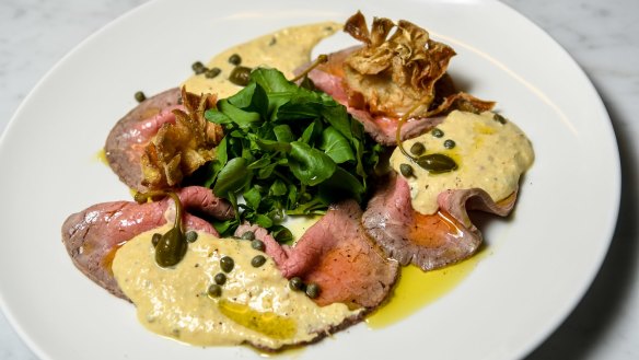 Vitello tonnato with crisp artichokes and caperberries.