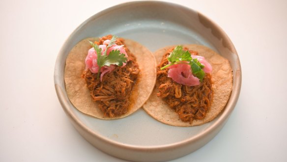 Pork tacos come in pairs.