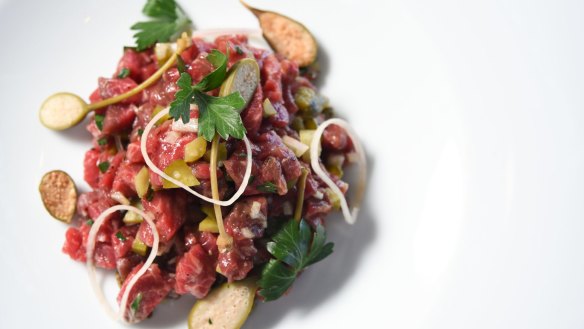 Steak tartare with Sher Wagyu beef, confit egg yolk and condiments.  