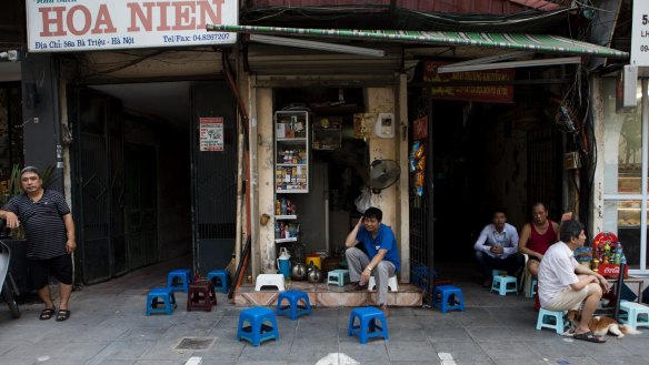 Painted lines mark the space where a street food vendor is able to set up shop, in Hanoi, Vietnam.