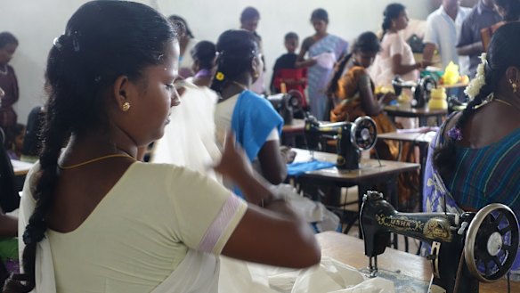 Fabric mill workers in Tamil Nadu in India. Many are underpaid and overworked.