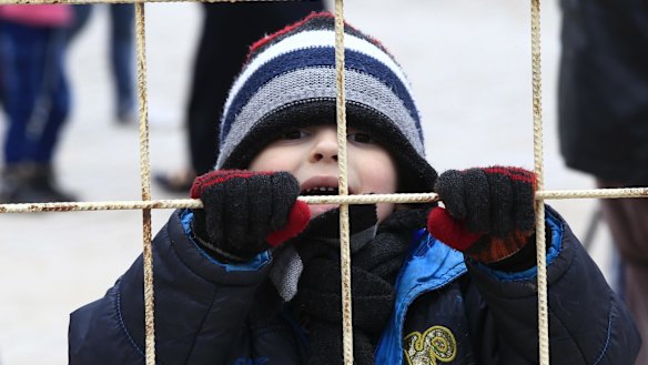 This child at the Turkish borderon near Kilis is among 11 million Syrians who have been forced to flee their homes.