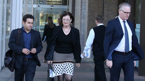 Former Fairfax journalist Linton Besser leaves the court with Fairfax journalists Kate McClymont and Sean Nicholls.