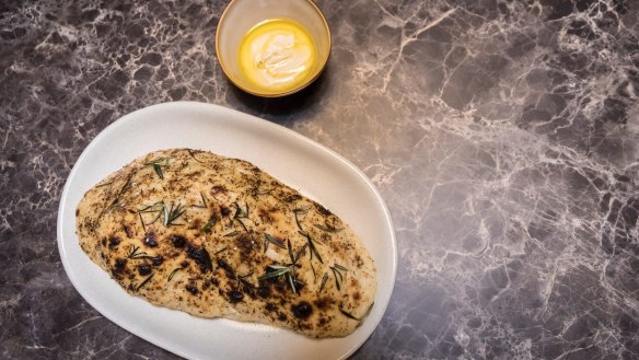 Rosemary and sesame flatbread with warm hummus.