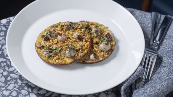 Socca (chickpea pancakes) topped with fermented walnuts at Patsy's.