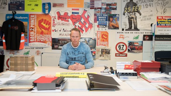 Niek Stam in his office in Rotterdam, Netherlands. In the 1970s, Rotterdam was the world's largest port and 25,000 stevedores worked there. 