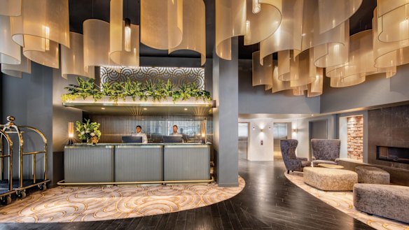 The snug, snazzily decked-out lobby includes the reception, a small lounge with a thoughtfully-included fireplace.