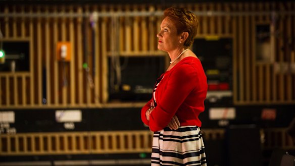 One Nation leader Pauline Hanson on the set of <i>Insiders</i>, watching host Barrie Cassidy.