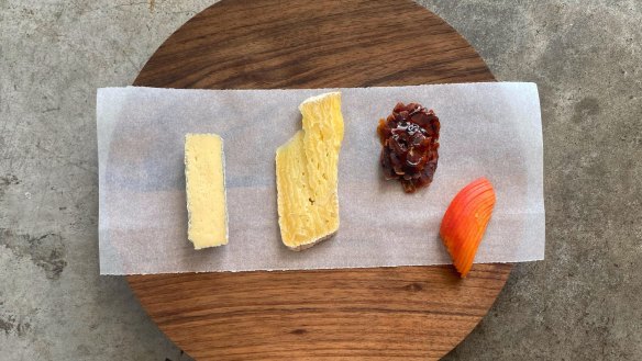 Pipit's house-made cheese board featuring surface-ripened blue (left) and tomme.