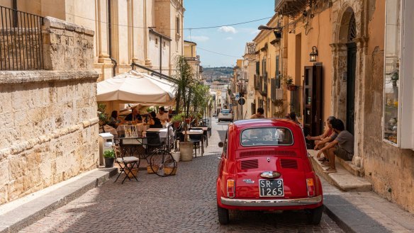 The cobblestoned streets and outdoor cafes of Noto.