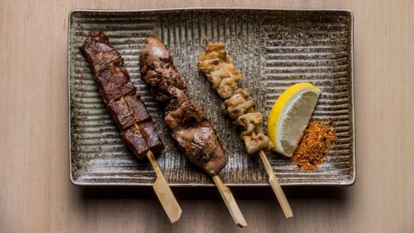 From left: Beef tongue, chicken liver and chicken skin skewers at Kura.