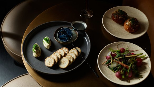 Clockwise from left: wild scampi caviar, sherry-glazed duck milk buns and locally grown vegetable pickles and ferments.