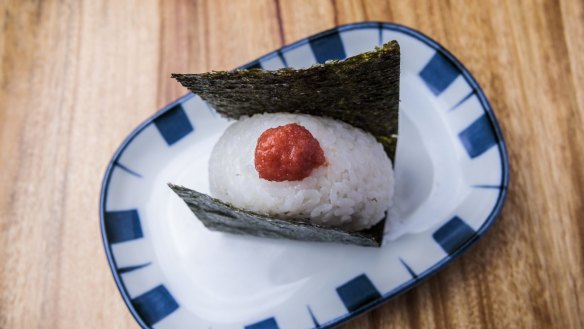 Hand-pressed onigiri rice balls stuffed with mentaiko.