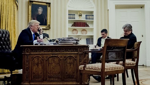 Mr Trump's national security adviser Michael Flynn, centre, and chief strategist Steve Bannon listen in on the President's phone call with Mr Turnbull.