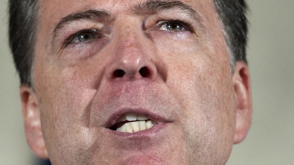 No charges: FBI director James Comey makes his statement at FBI Headquarters in Washington on Tuesday.
