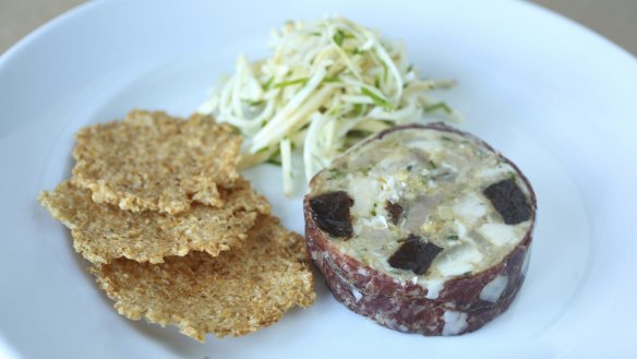 Salami-wrapped pork, leek and rabbit terrine with celeraic and rice crackers.